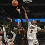South Carolina forward Joyce Edwards (8) defends the shot by University of Southern California forward Jazzy Davidson (9) Monday, March 23, 2026, after the Gamecocks won in the NCAA Basketball Schedule at Colonial Life Arena in Columbia, South Carolina.