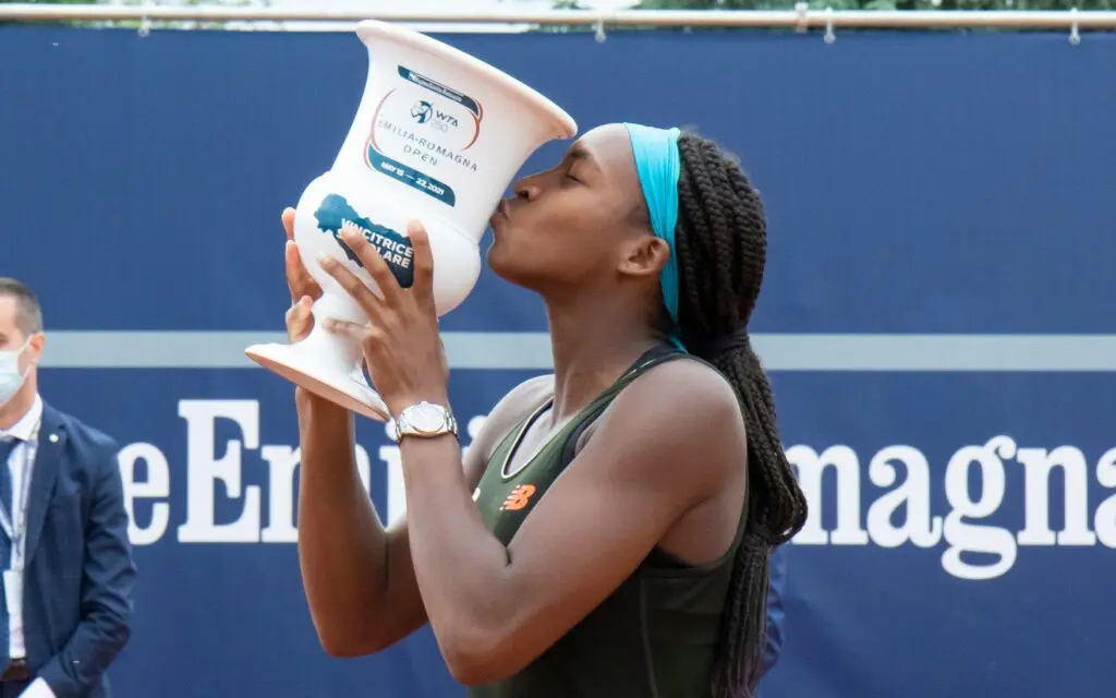 Player kissing the trophy after win/ JWS