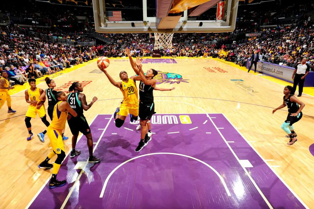 Basketball players in court/ JWS