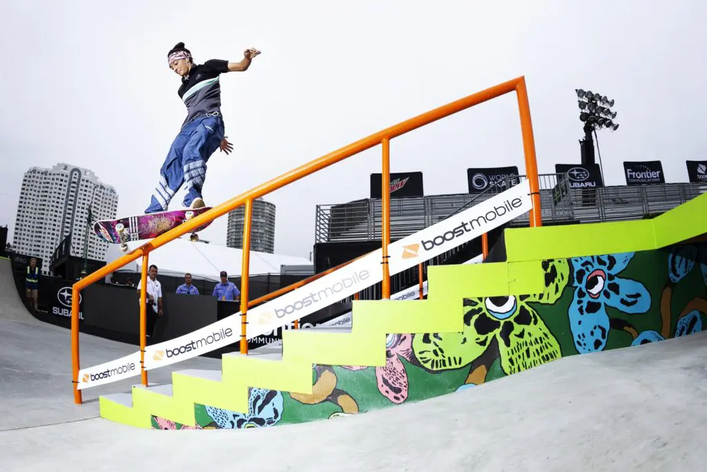Woman skateboarding on a staircase railing/ JWS