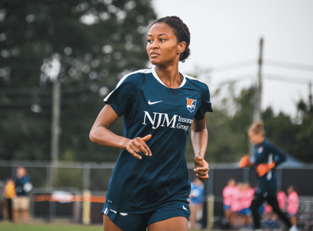 Woman player running/ JWS