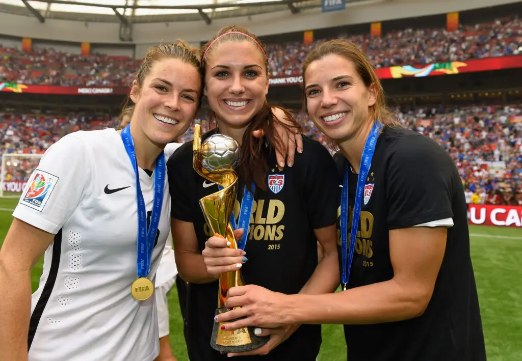 Kelley O'Hara, Alex Morgan and Tobin Heath celebrate 2015 world cup win with the uswnt