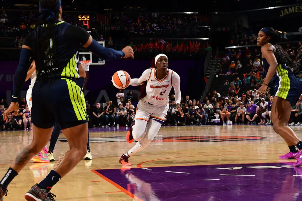 WNBA star Kahleah Copper of the Phoenix Mercury drives to the basket against the Dallas Wings