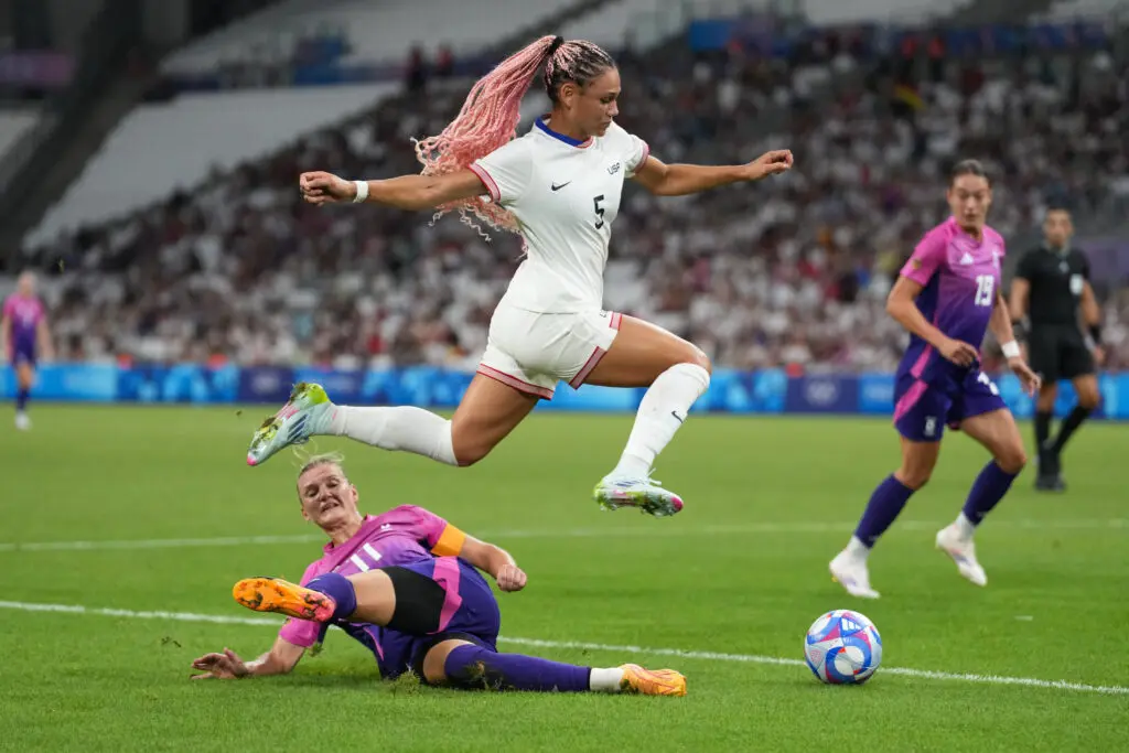 Trinity Rodman leaps over Germany's Alexandra Popp's tackle during the USWNT's 4-1 defeat of Germany on Sunday.