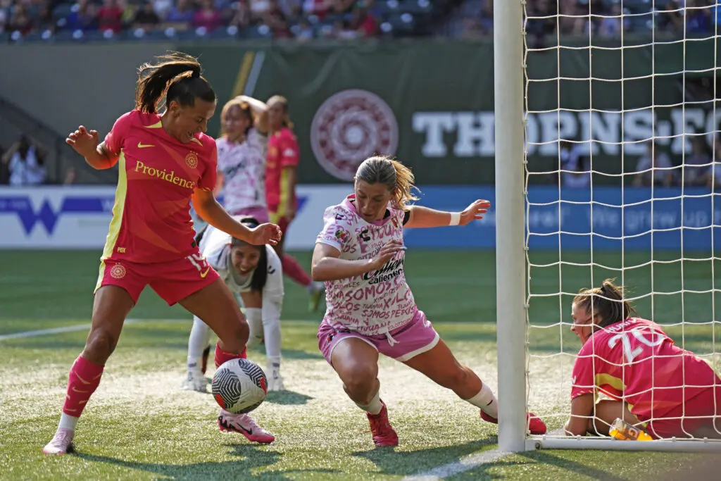 Thorns forward Ana Dias takes a shot against Tijuana defender Monica Alvarado during Portland's 5-0 Summer Cup victory on Sunday.