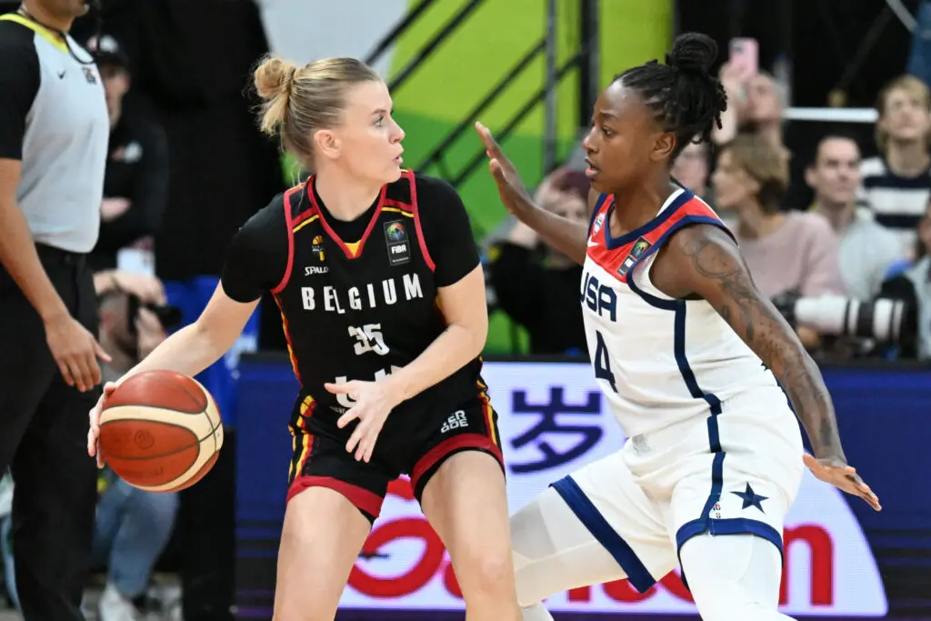 Julie Vanloo of Belgium playing basketball against Team USA's Jewell Loyd at the Olympic qualifying tournament