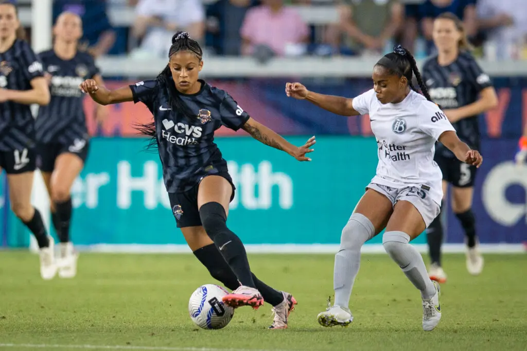 Washington Spirit rookie Croix Bethune controls the ball during a match.