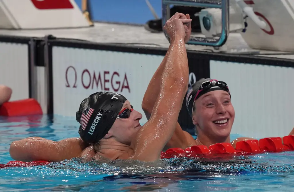800-meter freestyle gold medalist Katie Ledecky in the pool with bronze medalist Paige Madden