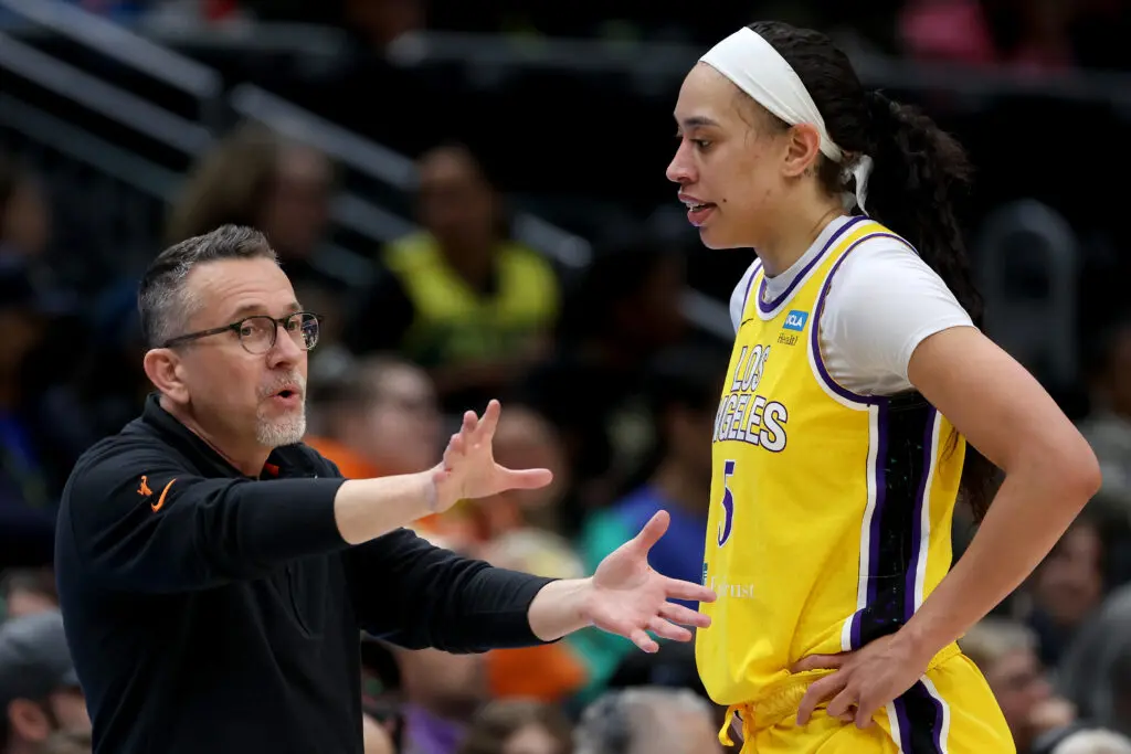 LA Sparks head coach Curt Miller talks with WNBA All-Star Dearica Hamby on the court