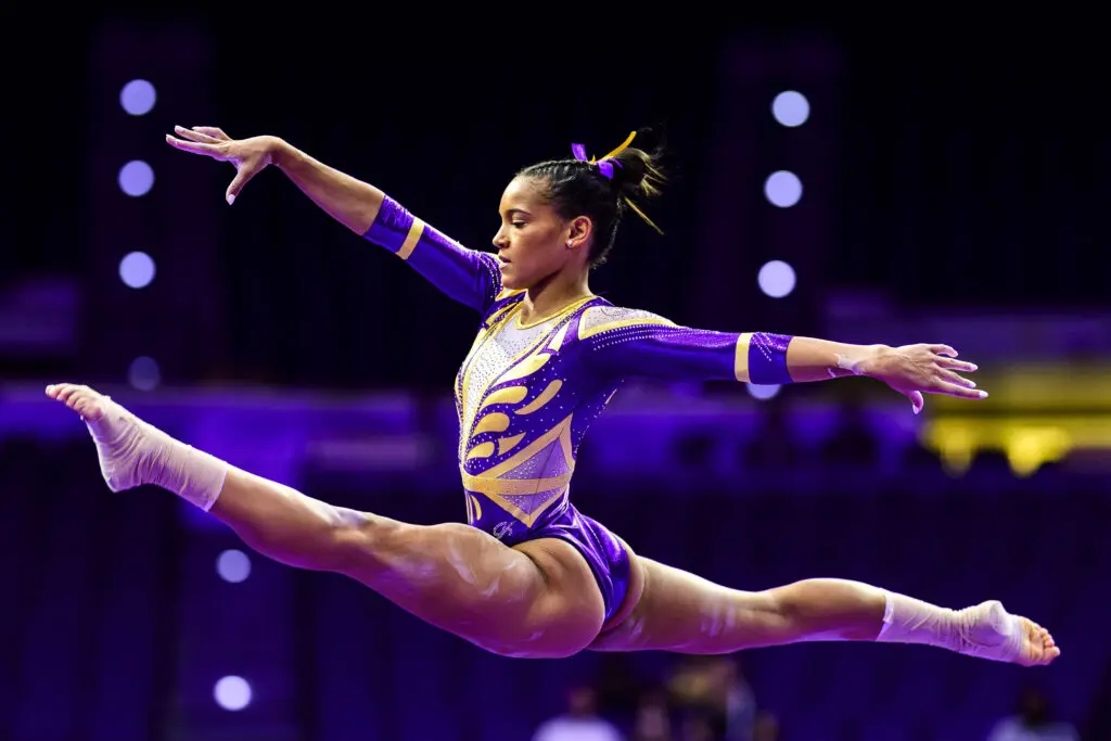 LSU's Haleigh Bryant does a split-leap during a December 2024 gymnastics exhibition meet.