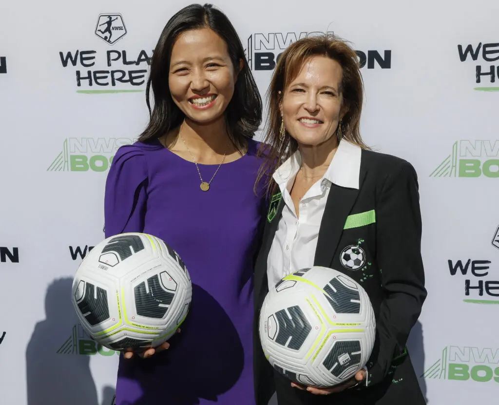 Boston mayor Michelle Wu and 2026 NWSL expansion team Boston Legacy FC's controlling owener Jennifer Epstein pose for a photo.