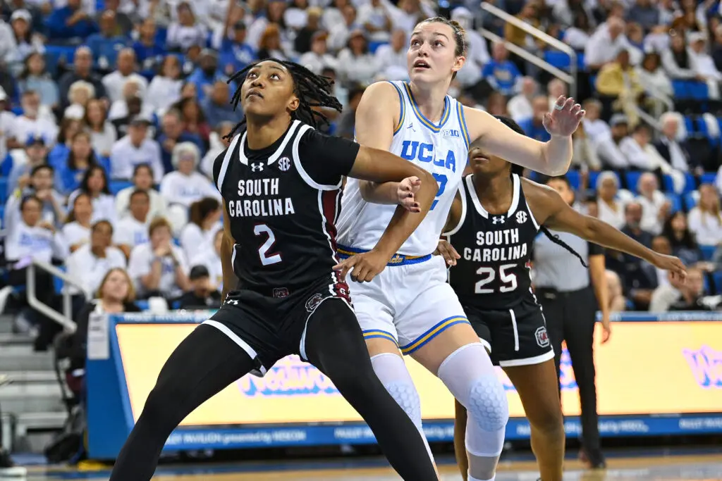 South Carolina's Ashlyn Watkins boxes out UCLA's Angela Dugalić during a 2024/25 NCAA basketball game.