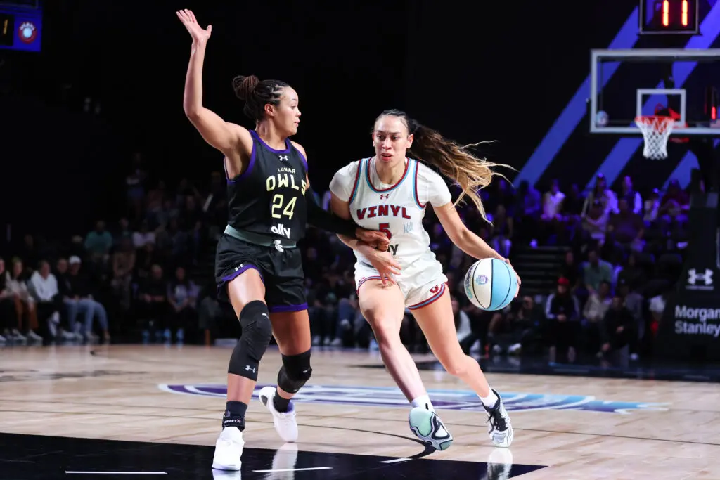 Vinyl's Dearica Hamby dribbles against Lunar Owls star Napheesa Collier during a 2025 Unrivaled game.