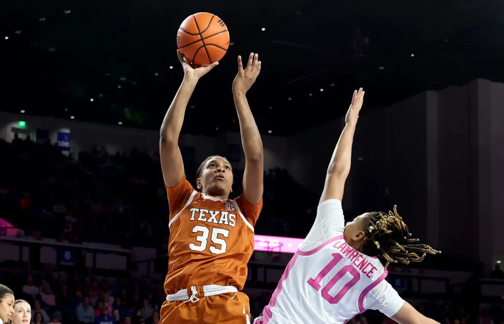 Texas star Madison Booker shoots over a Kentucky defender during a 2025 NCAA basketball game.
