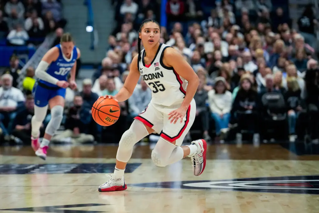 Azzi Fudd dribbles up the court during a 2025 UConn basketball game.
