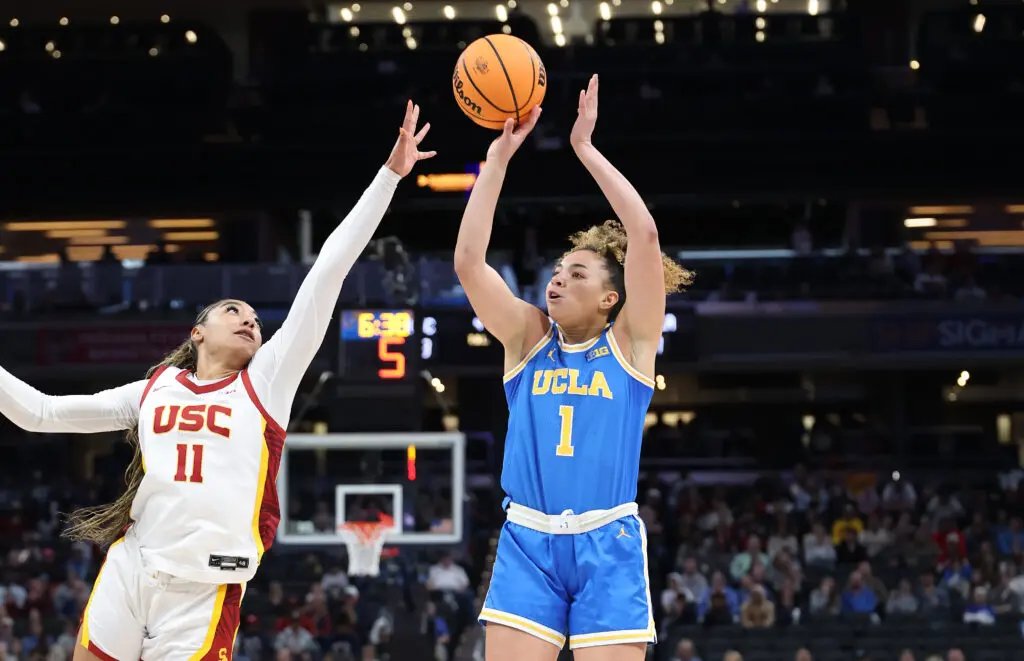 NCAA March Madness star Kiki Rice of the UCLA Bruins shoots against the USC Trojans during the Big Ten Women's Basketball Tournament Championship game.