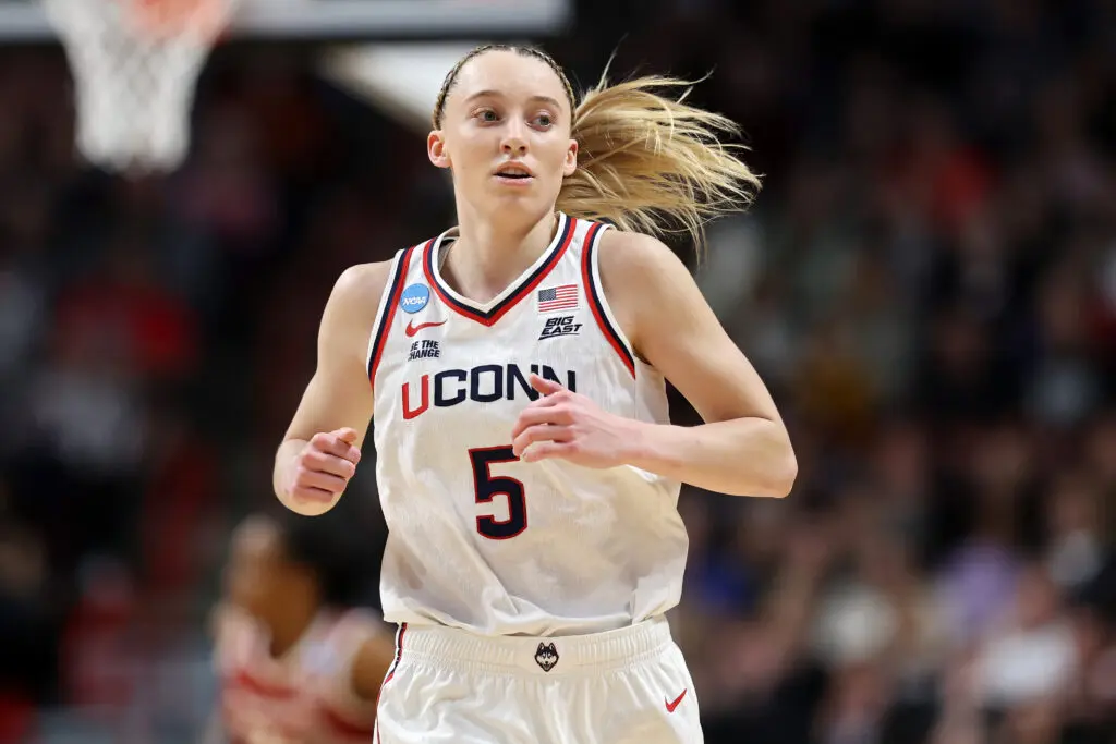 2025 WNBA draft pick Paige Bueckers #5 of the Connecticut Huskies jogs across the court in the first quarter against the Oklahoma Sooners in the Sweet Sixteen round of the NCAA Women's Basketball Tournament at Spokane Arena on March 29, 2025 in Spokane, Washington.