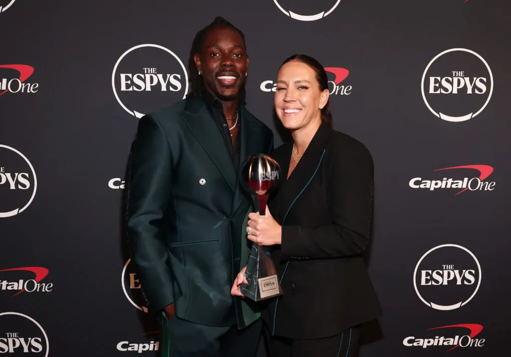 NBA star Jrue Holiday and USWNT World Cup champion Lauren Holiday pose at the 2023 ESPYS.