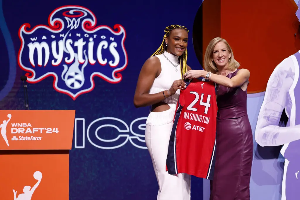 Washington Mystics star Aaliyah Edwards poses with league commissioner Cathy Engelbert at the 2024 WNBA Draft.