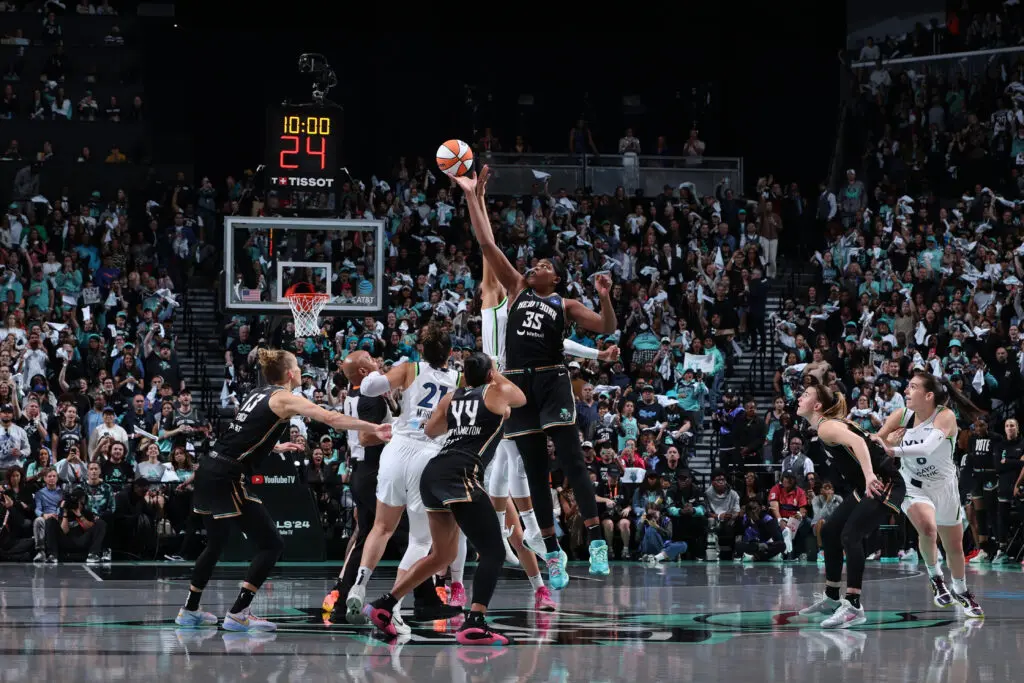 New York Liberty center Jonquel Jones leaps for the ball during the 2024 WNBA Finals tip-off against the Minnesota Lynx.