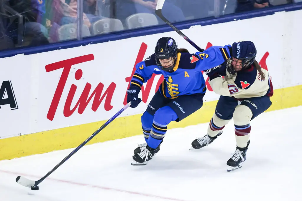 Toronto's Jocelyne Larocque skates with the pick against Montréal's Jennifer Gardiner during a 2024/25 PWHL game.