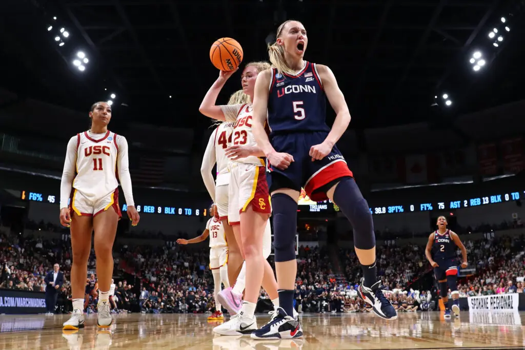 March Madness star Paige Bueckers #5 of the UConn Huskies reacts to a play under the basket against the USC Trojans during the Elite Eight round of the 2025 NCAA Tournament ahead of the Final Four.