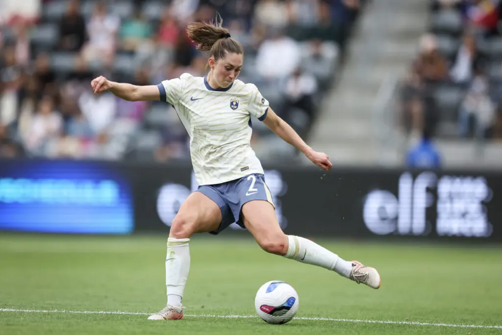 Seattle's Maddie Mercado passes the ball during a 2025 NWSL match.