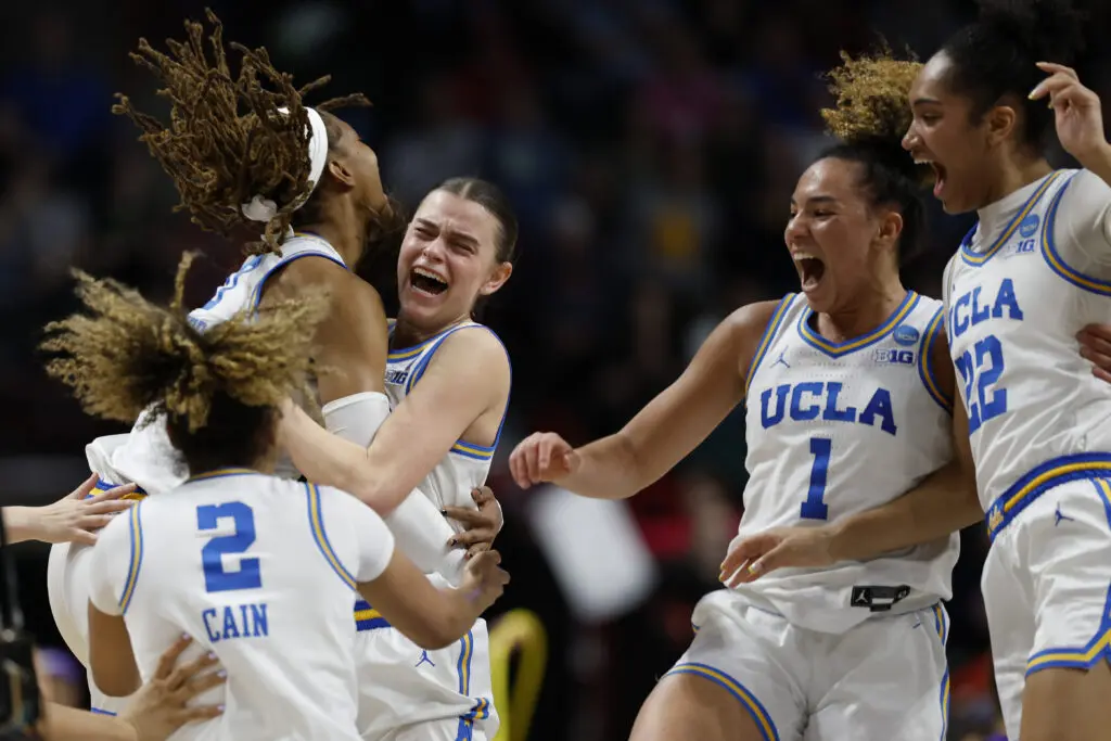 Final Four contenders the UCLA Bruins celebrate after winning the Spokane regional championship at the NCAA women's tournament.