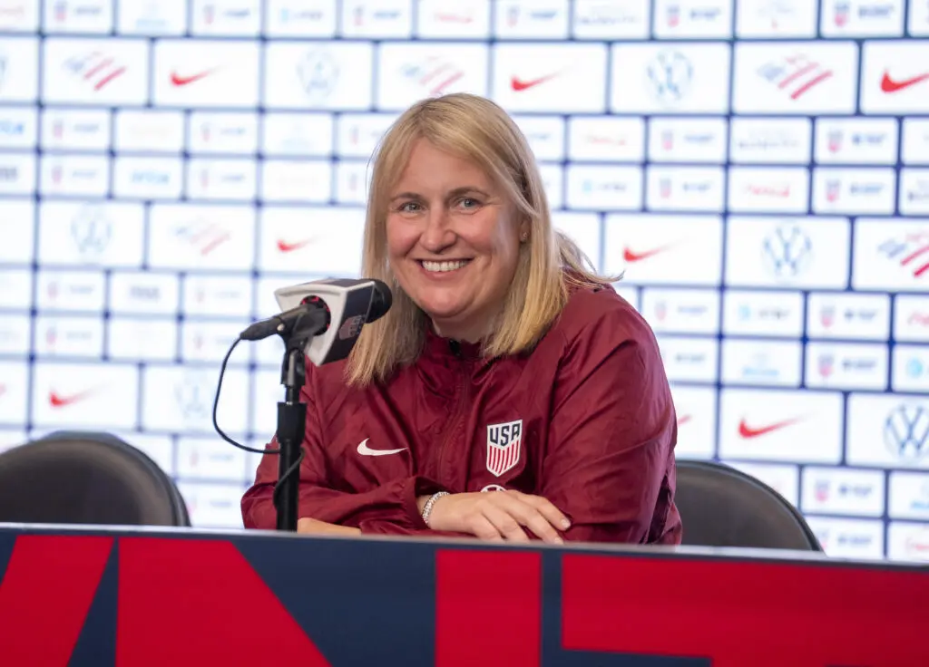 USWNT head coach Emma Hayes smiles while talking to reporters.