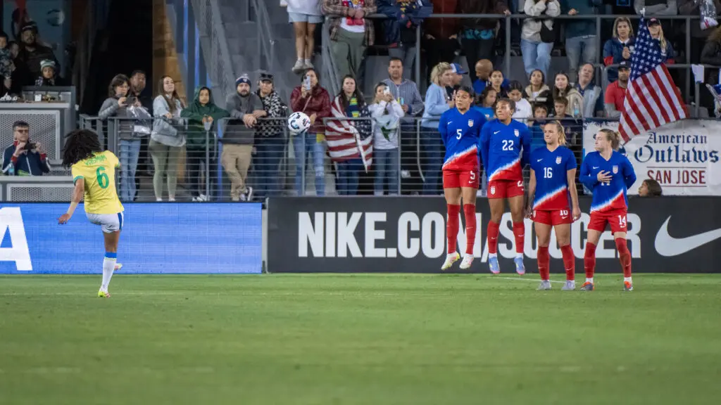The USWNT defends a free kick from Brazil's Yasmim during the pair's Tuesday friendly.