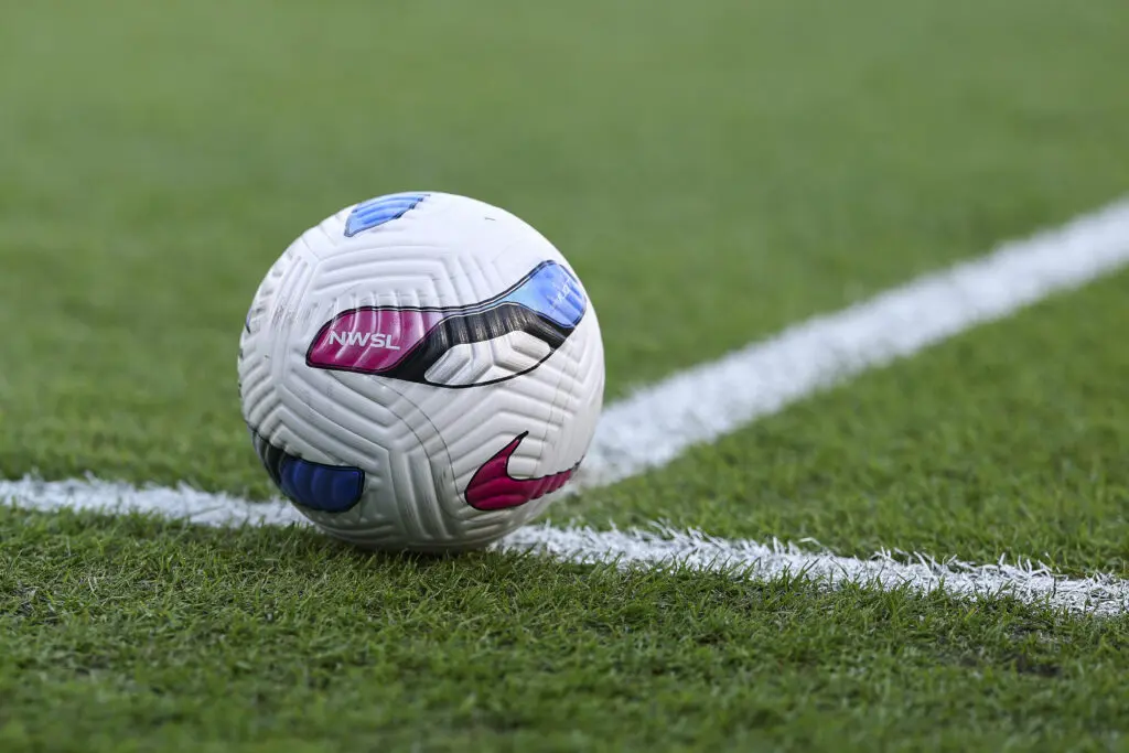 An NWSL ball sits on the pitch before a 2025 regular-season game.