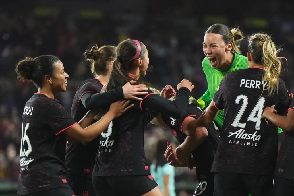Portland forward Deyna Castellanos celebrates scoring a goal with her teammates in a 2025 NWSL win over Gotham.