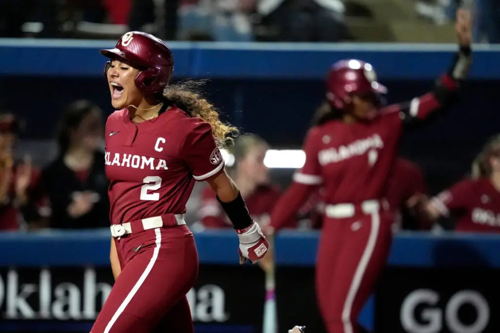 Oklahoma's Nelly McEnroe-Marinas scores during a 2025 NCAA softball game.
