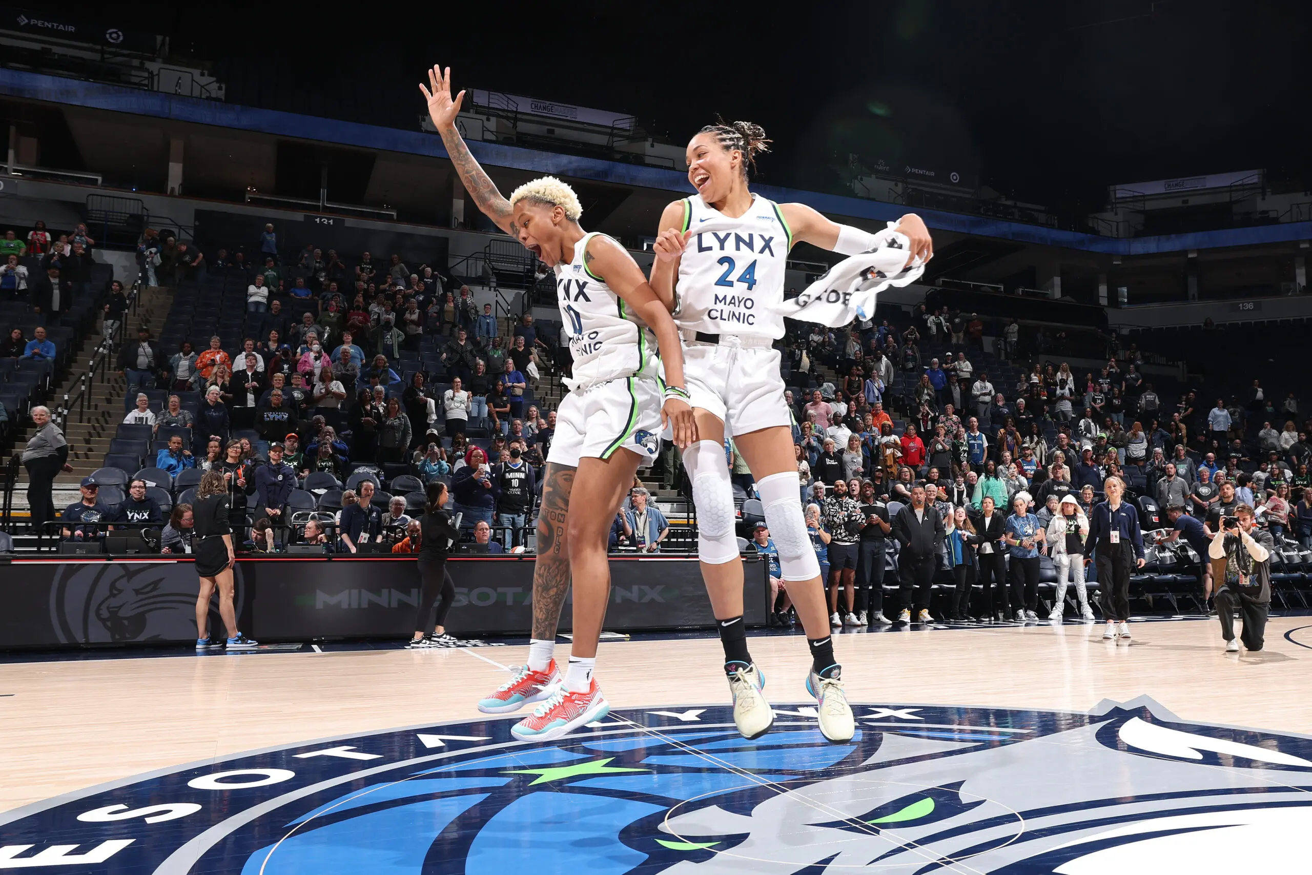 Jordan Brand athlete Napheesa Collier #24 and Courtney Williams #10 of the Minnesota Lynx embrace after the game against the Chicago Sky during a WNBA preseason game on May 3, 2024 at Target Center in Minneapolis, Minnesota. 