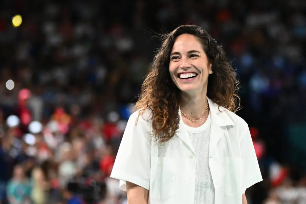 Retired WNBA and Team USA star Sue Bird smiles before the 2024 Olympic gold-medal game.