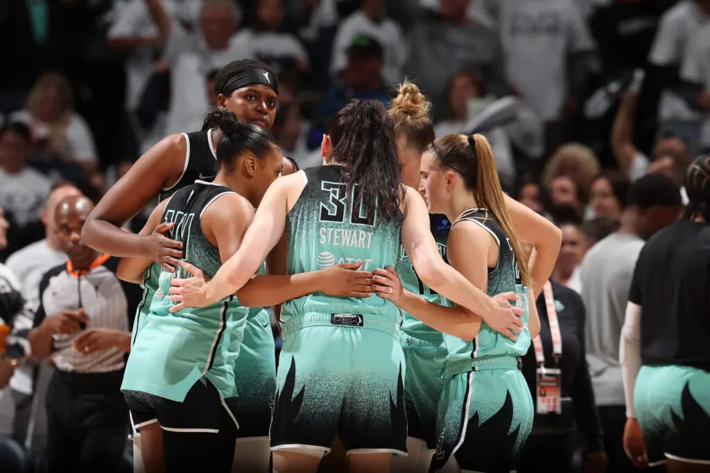 The New York Liberty huddle during a 2024 WNBA Finals game.