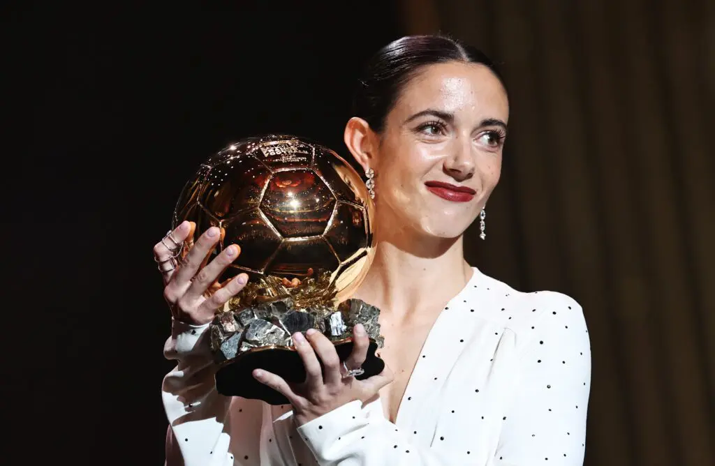 Spain’s Aitana Bonmatí poses holding her 2024 Ballon d'Or trophy.