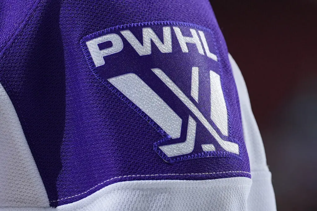 A close-up of the PWHL logo patch on the sleeve of a jersey.