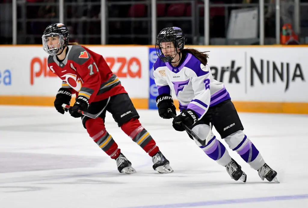Ottawa's Jincy Roese and Minnesota's Liz Schepers skate during a 2025 PWHL game.