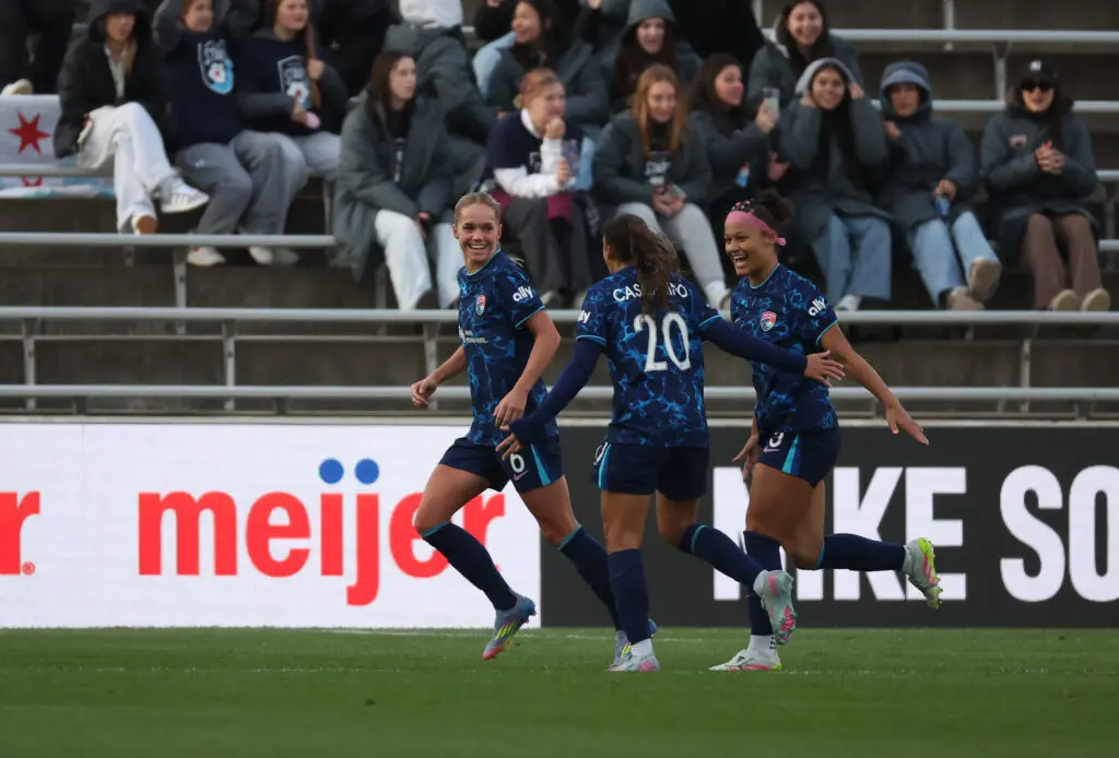 San Diego's Hanna Lundkvist, Delphine Cascarino, and Trinity Armstrong celebrate a goal during a 2025 NWSL game.