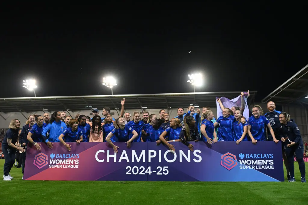 Chelsea players celebrate their 2024/25 WSL championship after a match.