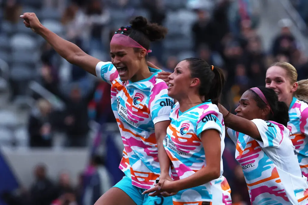 Trinity Armstrong celebrates a goal with her San Diego teammates during a 2025 NWSL game.