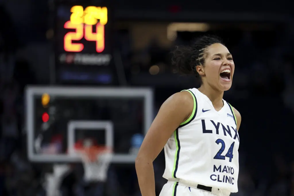 Minnesota Lynx star Napheesa Collier celebrates a play during a 2025 WNBA game against the Connecticut Sun.