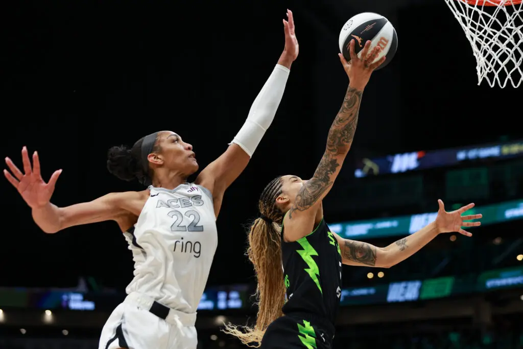 Las Vegas's A'ja Wilson tries to defend a lay-up from Seattle's Gabby Williams during a 2025 WNBA game.