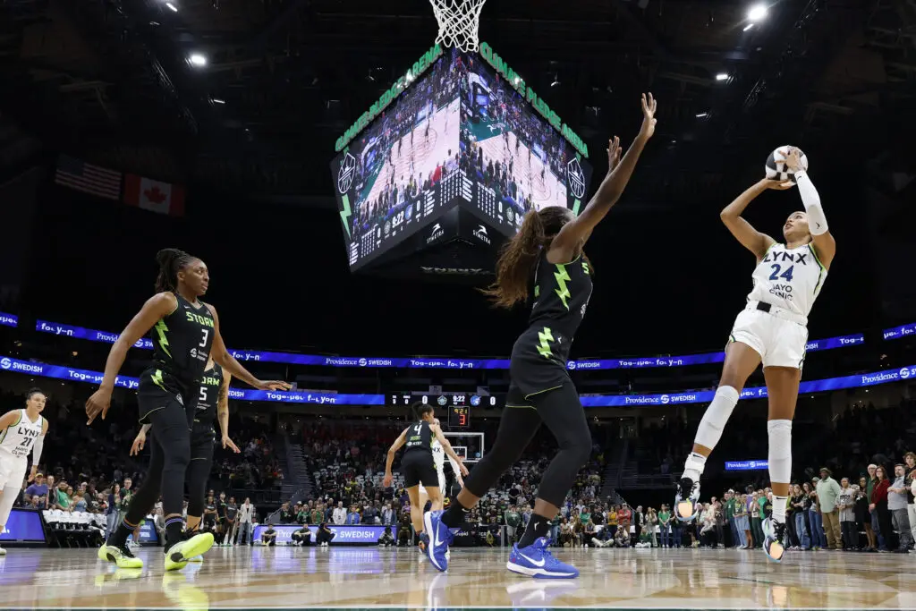 Seattle Storm forward Ezi Magbegor tries to defend a jump-shot from Minnesota Lynx forward Napheesa Collier during a 2025 WNBA Commissioner's Cup game.