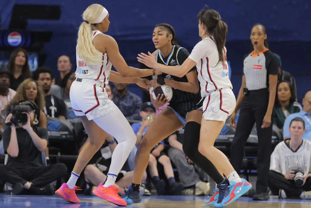 Angel Reese #5 of the Chicago Sky is doubled teamed by rookies Sonia Citron #22 of the Washington Mystics and Kiki Iriafen #44 of the Washington Mystics during the WNBA Commissioners Cup on June 17, 2025 at Wintrust Arena in Chicago,Illinois.
