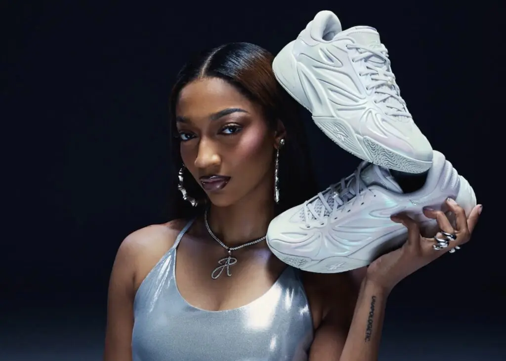 Angel Reese poses with her Reebok signature shoe.
