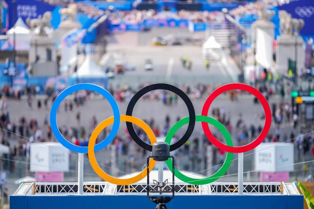 The Olympic rings sit on Eiffel Tower Stadium during the 2024 Paris Games.