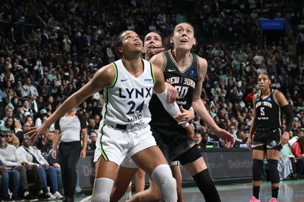 Minnesota Lynx star Napheesa Collier and New York Liberty standout Breanna Stewart eye a rebound during the 2024 WNBA Finals.