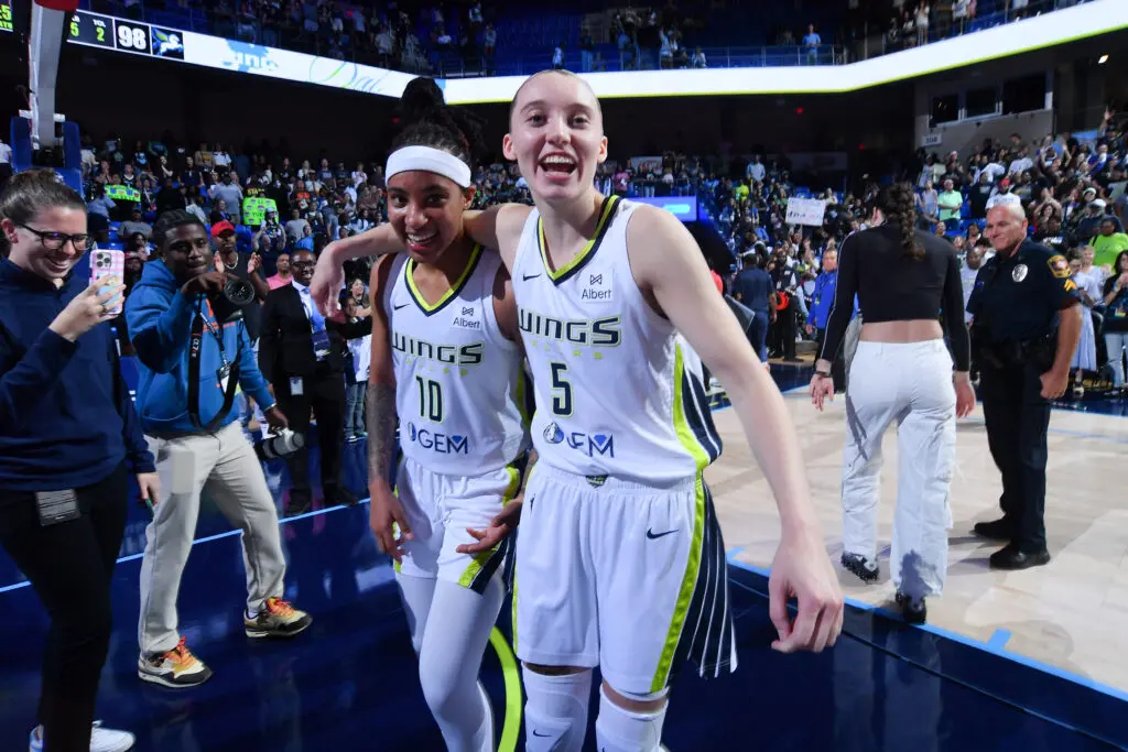 Dallas Wings rookies Aziaha James and Paige Bueckers celebrate a 2025 WNBA win.
